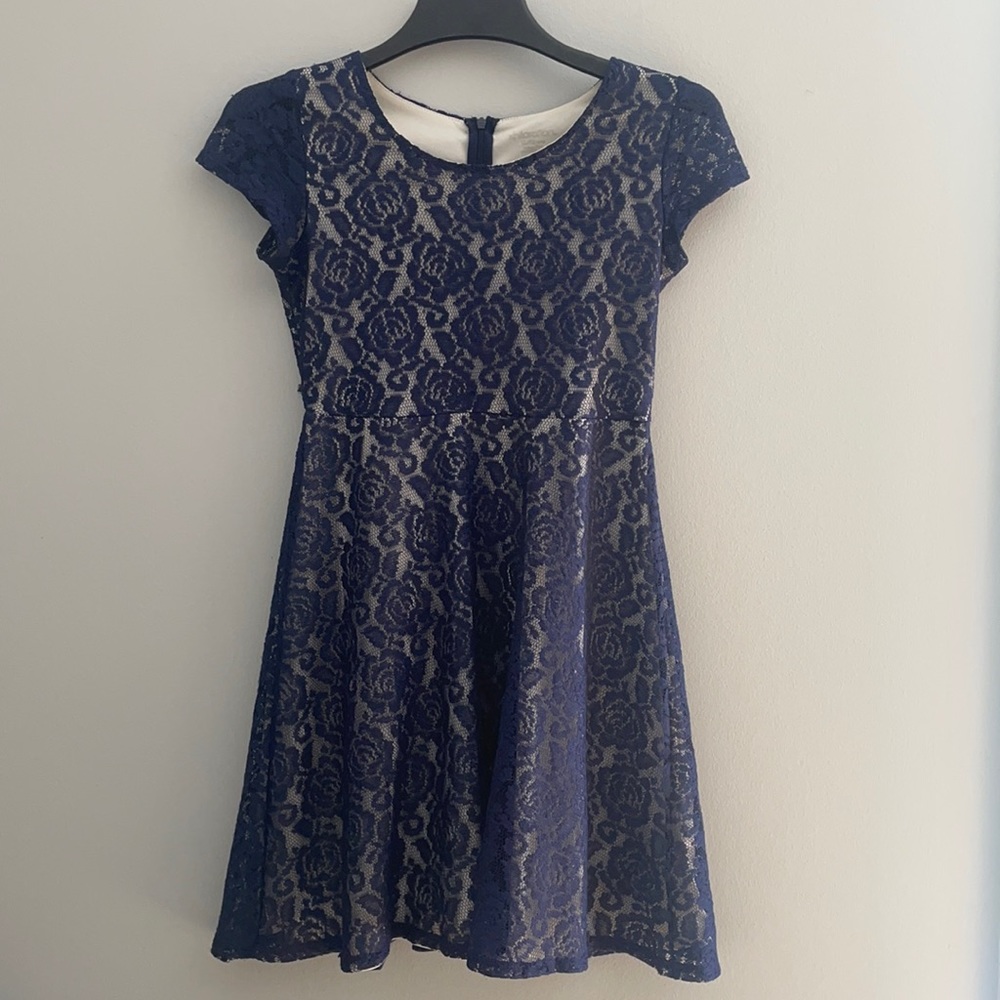 Navy lace rose pattern over cream dress
